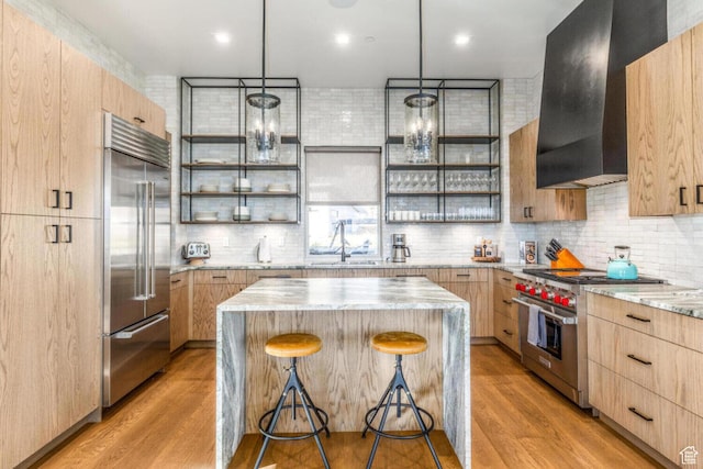 7485 E Moon Light Dr, Heber City, UT 84032 - kitchen with high quality appliances, light brown cabinets, a sink, a center island, and open shelves