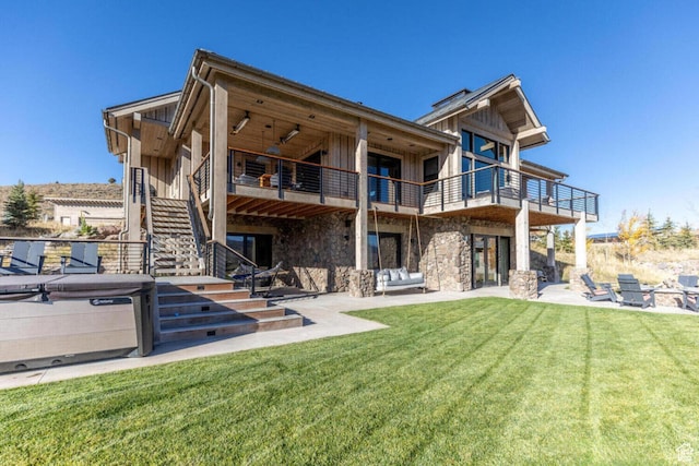 7485 E Moon Light Dr, Heber City, UT 84032 - rear view of property with stairway, a patio area, a lawn, and board and batten siding
