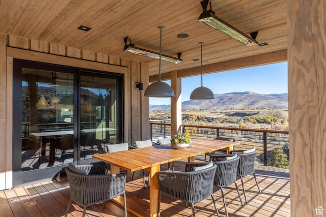 7485 E Moon Light Dr, Heber City, UT 84032 - deck with a mountain view, a ceiling fan, and outdoor dining space