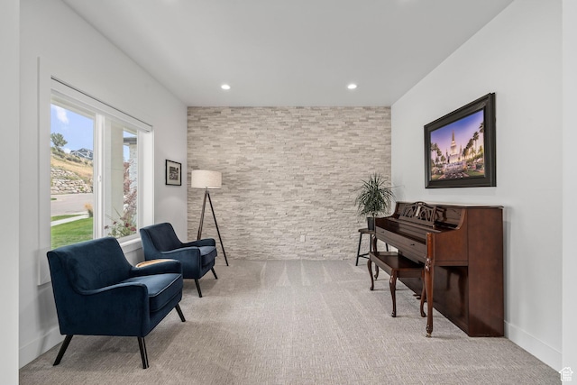sitting room with carpet floors and recessed lighting