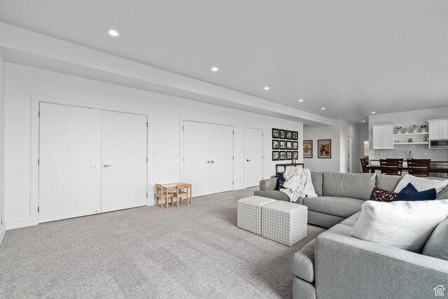 living room with carpet floors and recessed lighting