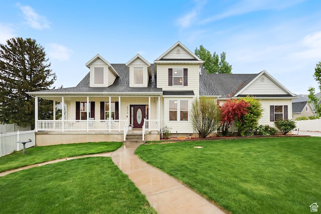 view of front of property with covered porch and a shingled roof