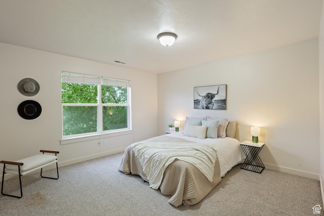 carpeted bedroom with baseboards