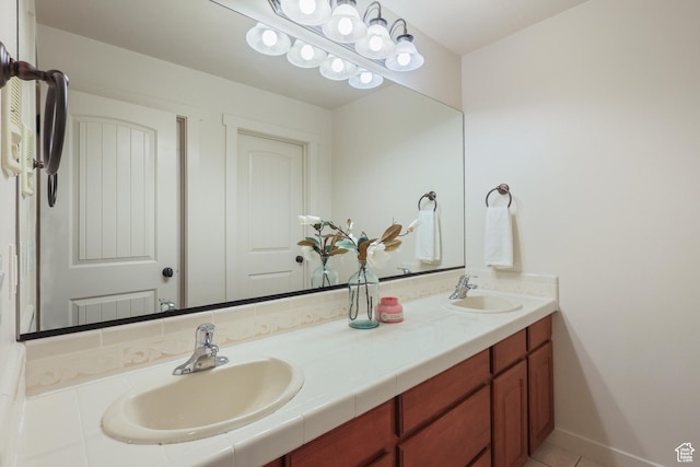 bathroom featuring double vanity and tile patterned flooring