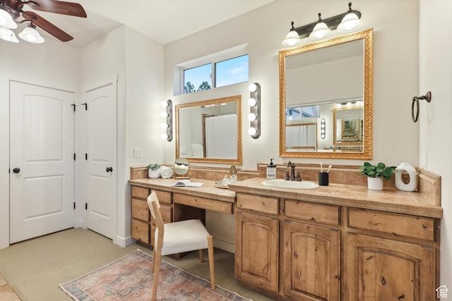 bathroom featuring a ceiling fan and vanity