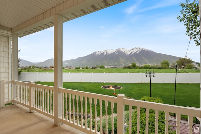 view of patio / terrace featuring a mountain view and a fire pit