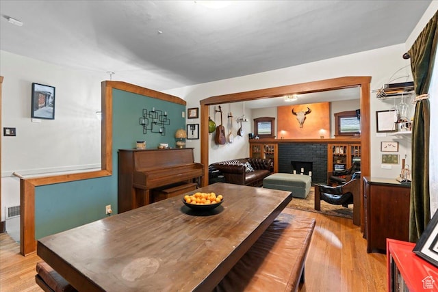162 E Cleveland, Salt Lake City, UT 84115 - dining area with light wood-style flooring and a brick fireplace