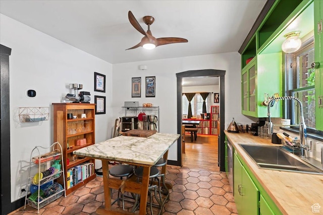 162 E Cleveland, Salt Lake City, UT 84115 - kitchen with green cabinetry, a sink, ceiling fan, wooden counters, and tile patterned flooring
