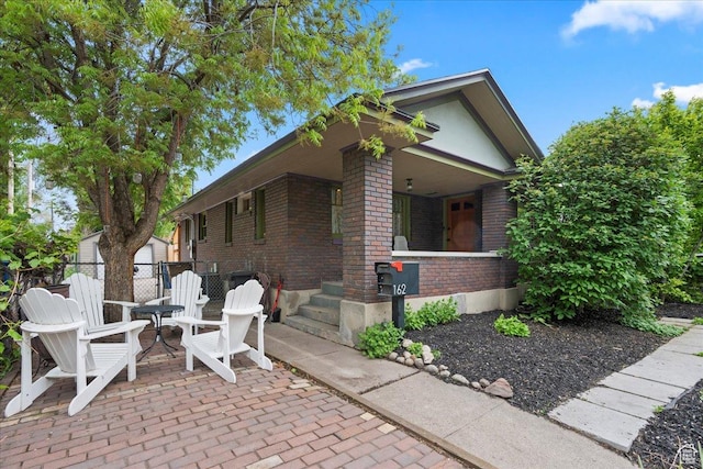 162 E Cleveland, Salt Lake City, UT 84115 - view of home's exterior with brick siding, a porch, and fence