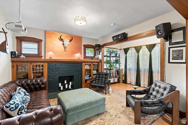 162 E Cleveland, Salt Lake City, UT 84115 - living room featuring a brick fireplace and wood finished floors