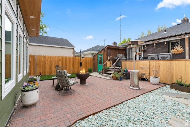 162 E Cleveland, Salt Lake City, UT 84115 - view of patio / terrace with a fire pit, a fenced backyard, and an outbuilding