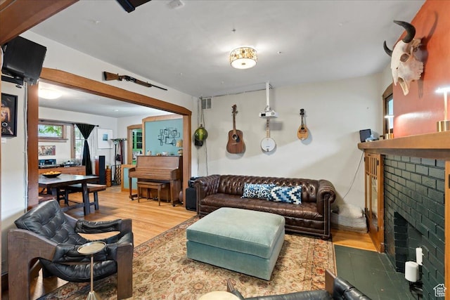 162 E Cleveland, Salt Lake City, UT 84115 - living area featuring a brick fireplace and wood finished floors
