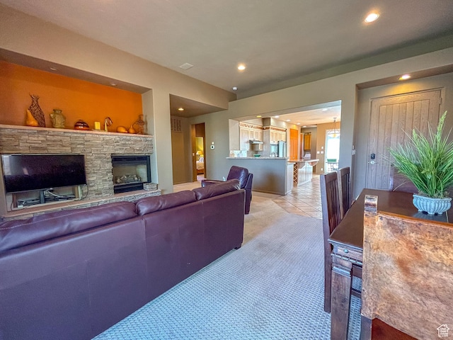 2255 N Tuweap Dr Unit 50, St George, UT 84770 - living area with recessed lighting, a fireplace, light colored carpet, and light tile patterned flooring