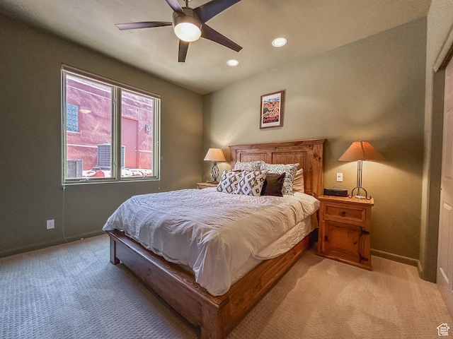 2255 N Tuweap Dr Unit 50, St George, UT 84770 - bedroom with light colored carpet, baseboards, recessed lighting, and a ceiling fan