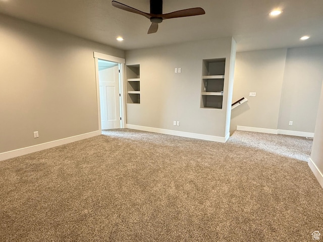 295 E 2nd N, Paris, ID 83261 - unfurnished living room featuring a ceiling fan, recessed lighting, carpet flooring, baseboards, and built in shelves