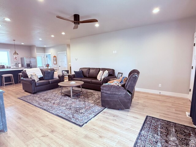 295 E 2nd N, Paris, ID 83261 - living room with light wood-style flooring, a ceiling fan, recessed lighting, and baseboards