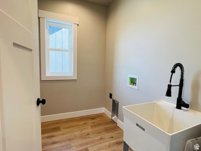 295 E 2nd N, Paris, ID 83261 - laundry room with washer hookup, light wood-style floors, and baseboards