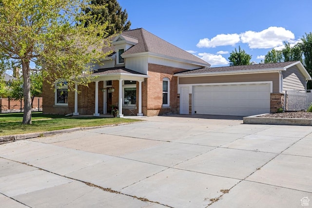 105 S 500 E, Salem, UT 84653 - view of front facade with brick siding, driveway, an attached garage, covered porch, and a front lawn