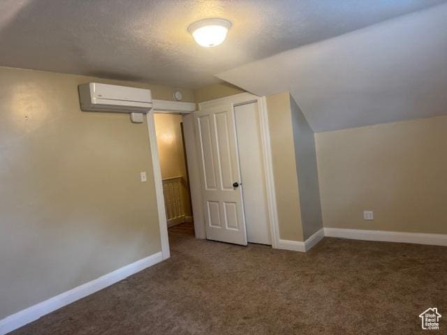105 S 500 E, Salem, UT 84653 - additional living space with a wall mounted AC, carpet floors, baseboards, a textured ceiling, and lofted ceiling