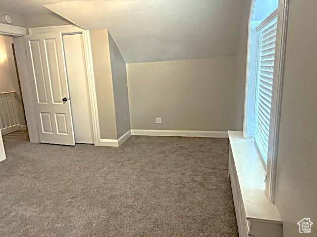 105 S 500 E, Salem, UT 84653 - additional living space featuring carpet floors, vaulted ceiling, and baseboards
