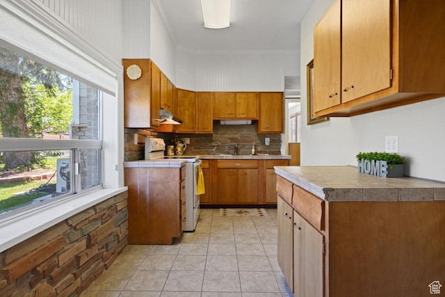 105 S 500 E, Salem, UT 84653 - kitchen featuring white range with electric cooktop, under cabinet range hood, backsplash, light tile patterned floors, and brown cabinets