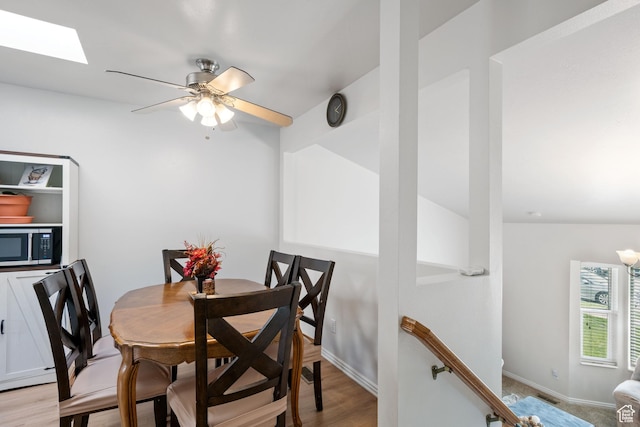 228 W 470 S, American Fork, UT 84003 - dining room featuring a skylight, a ceiling fan, light wood-style flooring, and baseboards
