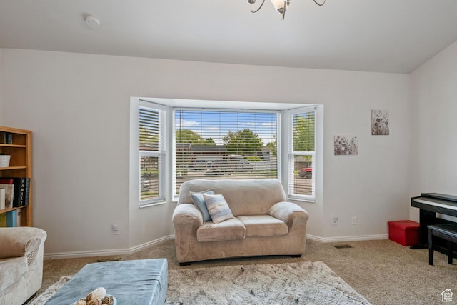 228 W 470 S, American Fork, UT 84003 - carpeted living room featuring baseboards and a chandelier