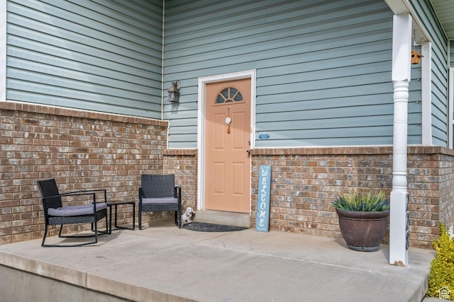 228 W 470 S, American Fork, UT 84003 - doorway to property featuring a patio and brick siding