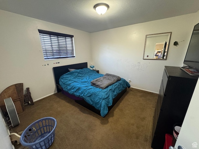 carpeted bedroom featuring baseboards