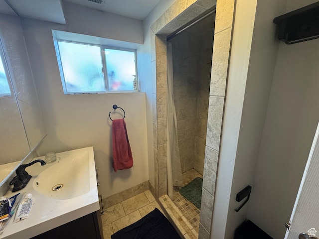 full bath featuring a stall shower and vanity