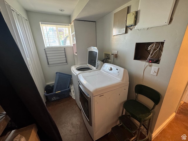 laundry area featuring washing machine and dryer and carpet flooring