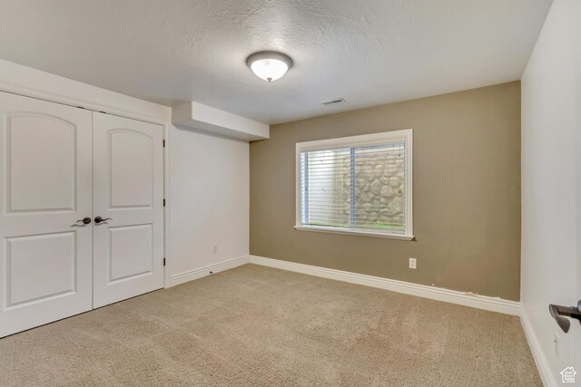 161 S 980 E, American Fork, UT 84003 - unfurnished bedroom with carpet floors, baseboards, a textured ceiling, and a closet