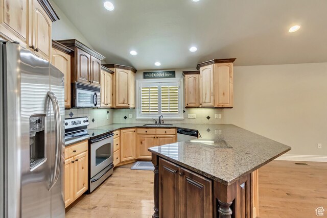 161 S 980 E, American Fork, UT 84003 - kitchen with appliances with stainless steel finishes, a peninsula, light brown cabinets, light wood-type flooring, and a sink