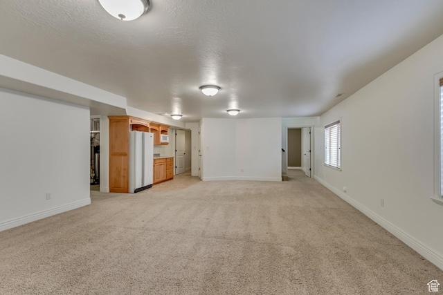 161 S 980 E, American Fork, UT 84003 - unfurnished living room featuring light colored carpet and baseboards