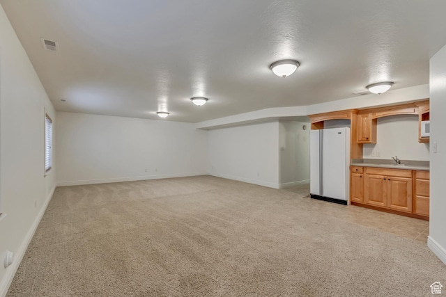 161 S 980 E, American Fork, UT 84003 - basement with freestanding refrigerator, a sink, light carpet, and baseboards