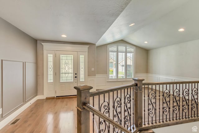 161 S 980 E, American Fork, UT 84003 - foyer entrance featuring vaulted ceiling, a wainscoted wall, a decorative wall, wood finished floors, and recessed lighting