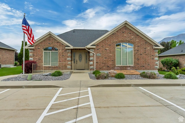 161 S 980 E, American Fork, UT 84003 - view of front of house with brick siding, uncovered parking, and a shingled roof