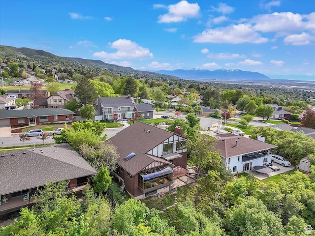 aerial view of residential area featuring mountains