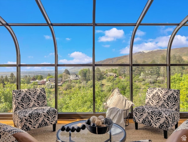 sunroom with a mountain view