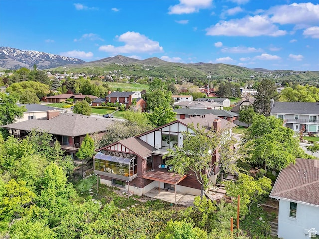 aerial view of residential area featuring a mountain backdrop
