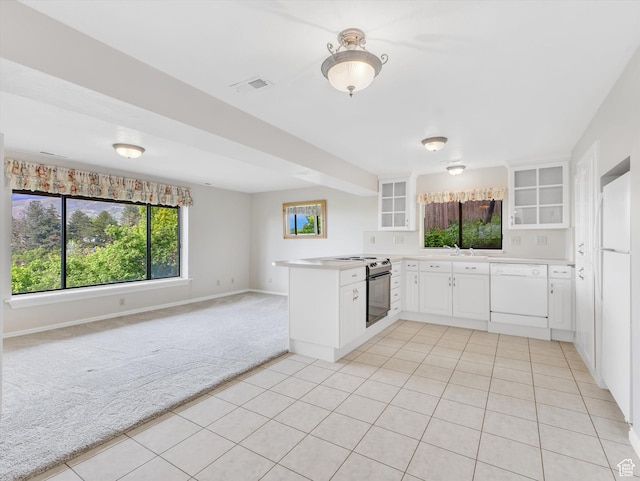 kitchen with white dishwasher, light colored carpet, a peninsula, glass insert cabinets, and open floor plan