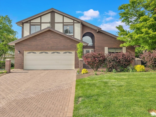 view of front of property featuring brick siding, decorative driveway, a front lawn, and a garage