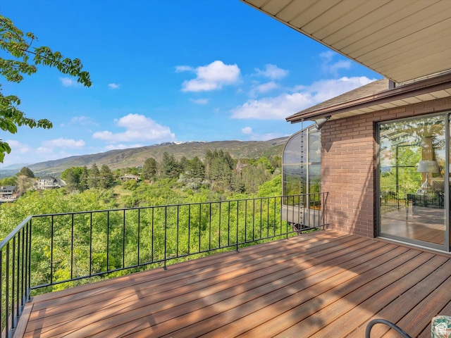 wooden deck with a mountain view