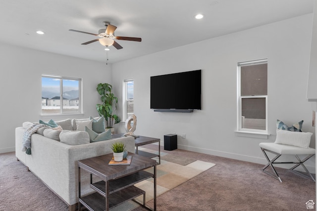 living area with light carpet, ceiling fan, recessed lighting, and baseboards
