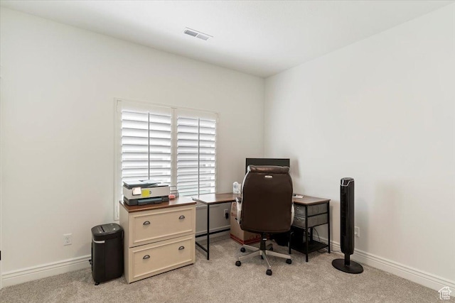office area with light colored carpet and baseboards