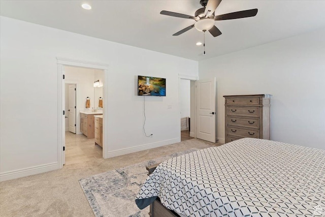 bedroom featuring light colored carpet, recessed lighting, baseboards, connected bathroom, and ceiling fan