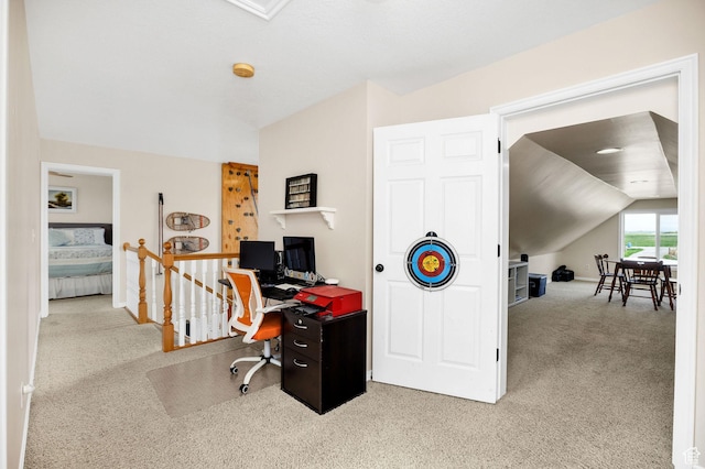 office space featuring carpet, lofted ceiling, and baseboards