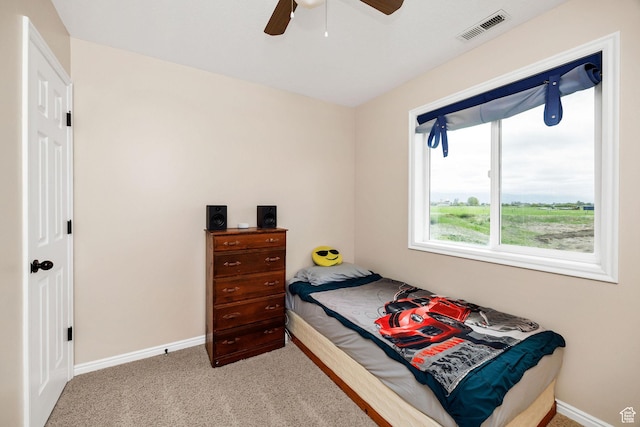 bedroom featuring baseboards, carpet floors, and ceiling fan