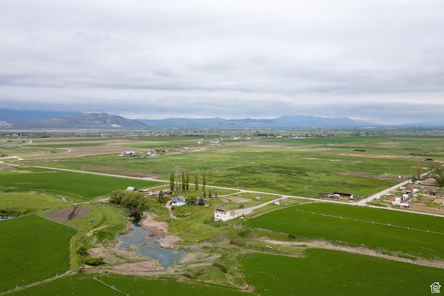 view of property location featuring a mountain backdrop and rural landscape