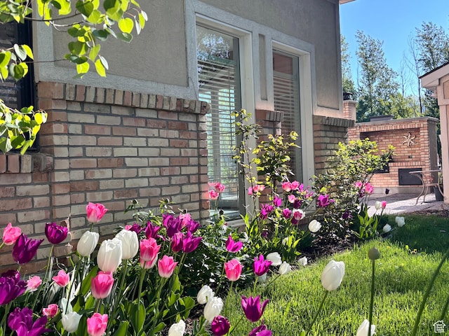 exterior view of stucco siding and brick siding